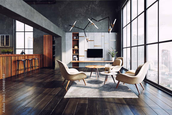 a loft living room with wooden flooring and large windows test