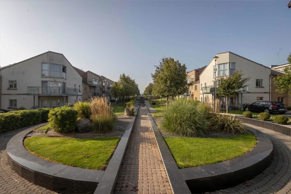 a city street with houses on the side of it