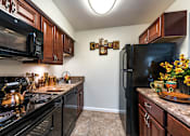 Thumbnail 4 of 17 - 1 Bedroom Apartment Kitchen at River Mews Apartments near Fort Eustis