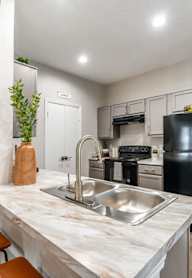 a kitchen with wooden cabinets and stainless steel appliances at Westover on 80, Mesquite