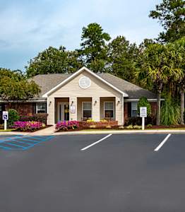 A building with a driveway in front of it.