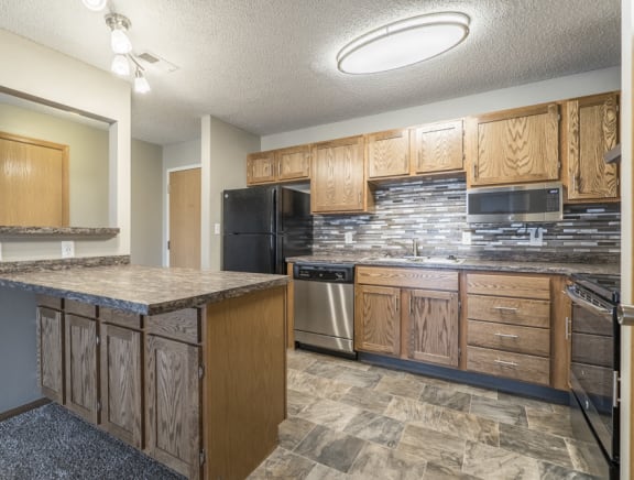 Interiors-Renovated kitchen with tile backsplash and new appliances