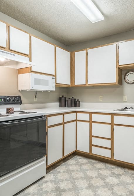 Large kitchen with many cabinets for storage at Fountain Glen