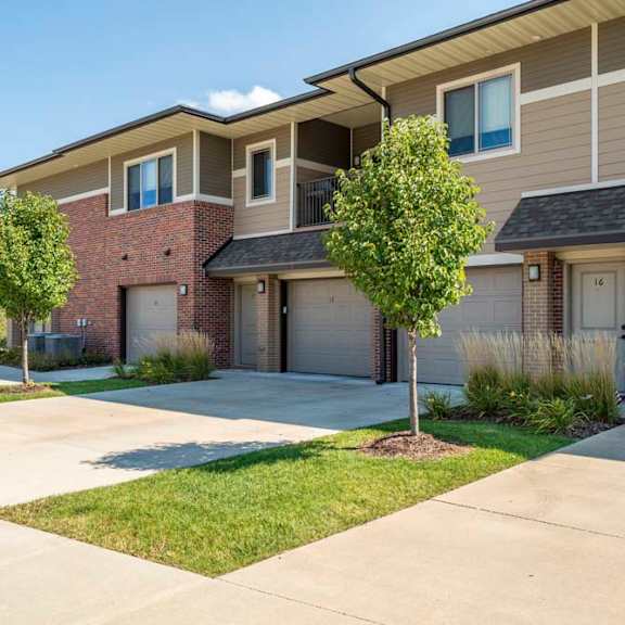 a villa apartment community with private entries and attached garages