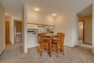 Dining area and kitchen view at Pine Lake Heights Apartments