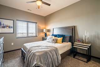 Spacious bedroom large enough for a bed and dresser at 360 at Jordan West