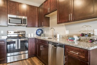 Updated stainless steel appliances in the kitchen at 360 at Jordan West