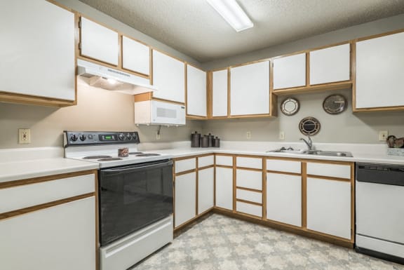 Large kitchen with many cabinets for storage at Fountain Glen