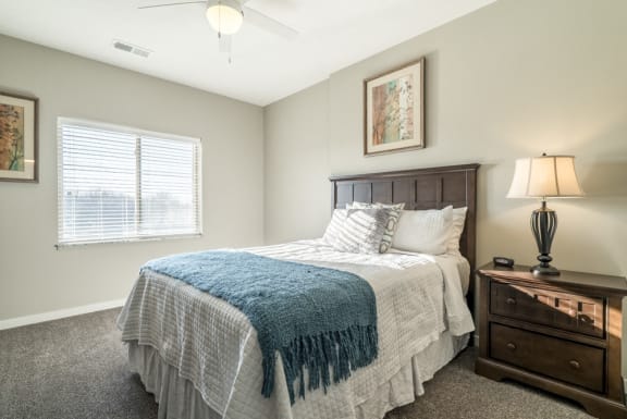 Spacious bedroom with lots of natural lighting at The Villas at Mahoney Park