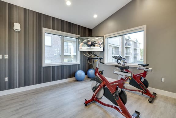 Stationary spin bikes with TV for fitness classes at Highland View fitness center