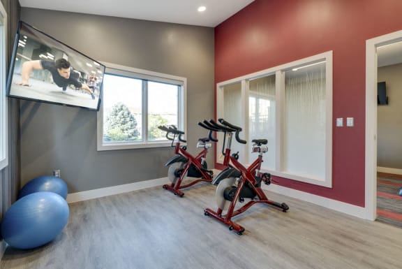Stationary spin bikes with TV for fitness classes at Highland View fitness center