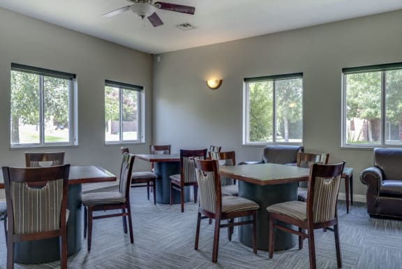 Dining tables with chairs at clubhouse at Pinebrook