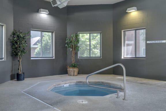 Indoor hot tub spa with windows looking outside at Pinebrook