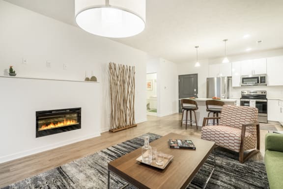 Modern built in fireplace with white surround in a living room at The Conrad