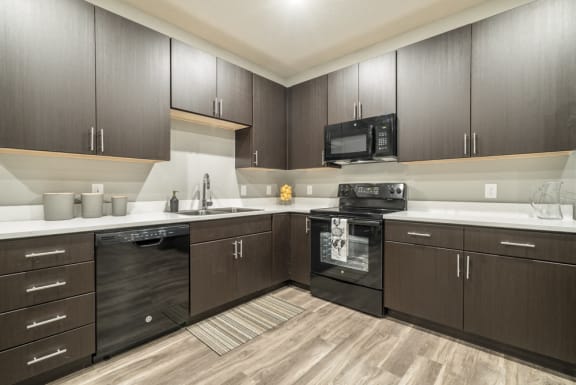 The Conrad-Traditional design scheme with dark cabinetry and light countertops