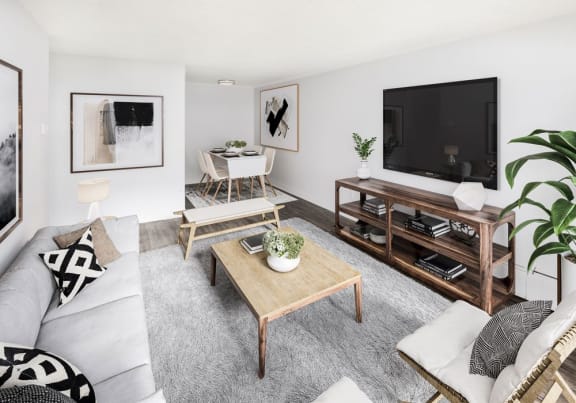 View of living room, staged with mid-century modern furniture.