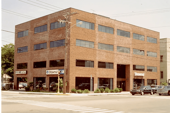 A red brick building with the word "Shawmand" on the front.