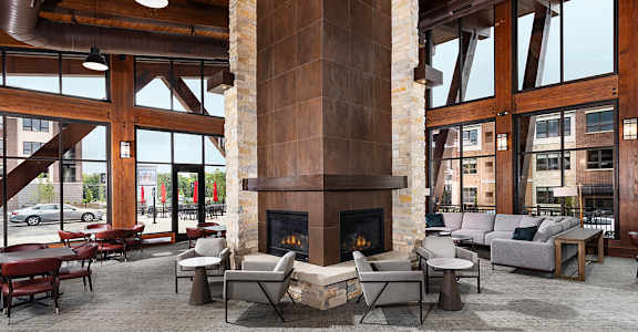 A large room with a fireplace and a couch.