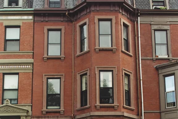 A red brick building with many windows.