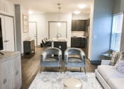 Thumbnail 20 of 44 - Living Room With Kitchen View at The Ivy at Berlin Place, South Bend