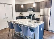 Thumbnail 22 of 44 - Fitted Kitchen With Island Dining at The Ivy at Berlin Place, South Bend, 46601