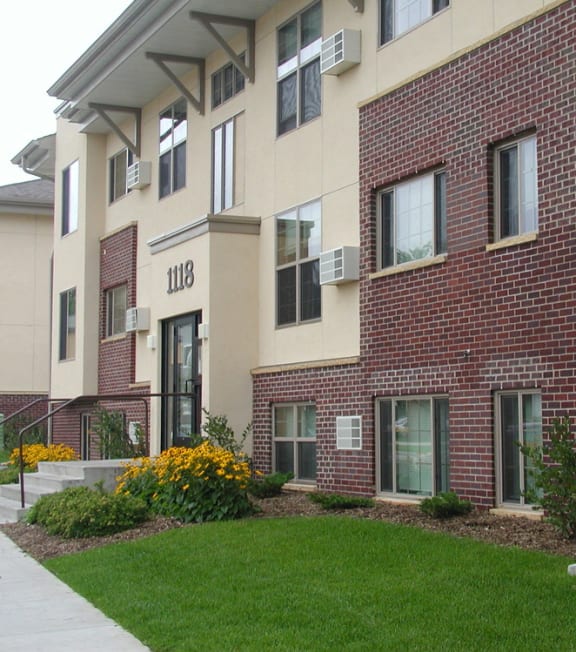 Apartment building with the number 118 on the front.