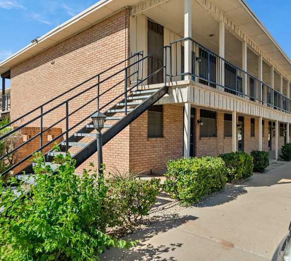 A building with a staircase leading to the second floor.