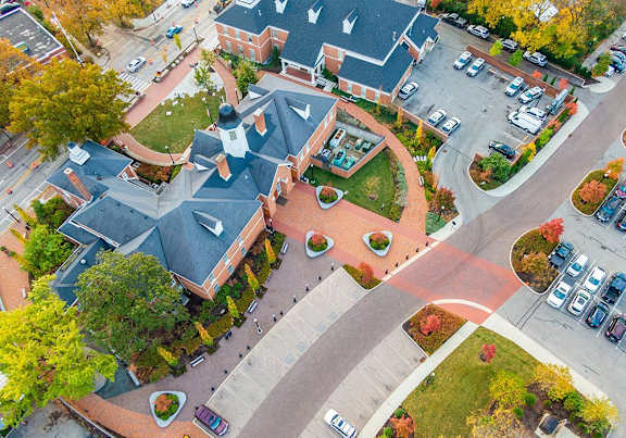 an aerial view of a neighborhood with a street and buildings