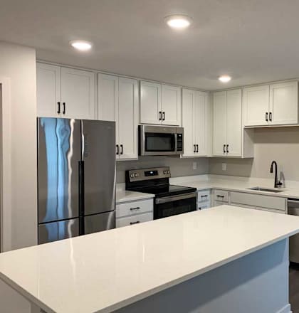 kitchen with white cabinets and stainless steel appliances