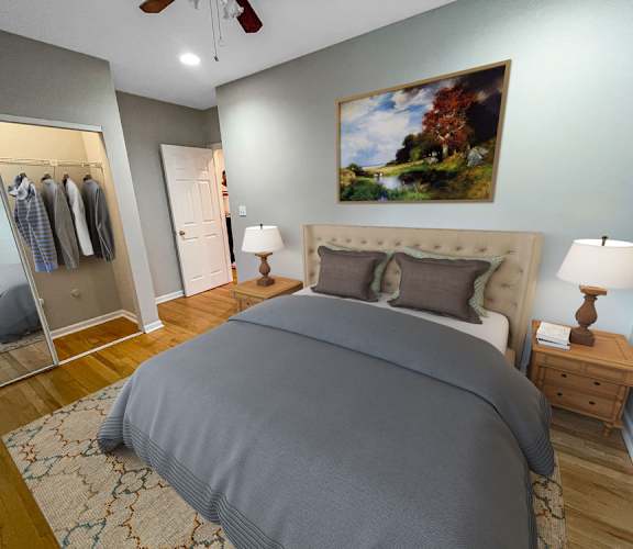 a bedroom with a bed and a closet with a mirror