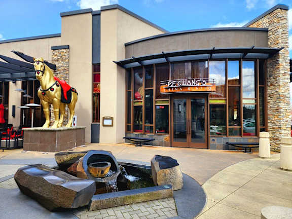 A restaurant named Pei Chang's is shown with a golden horse statue in front.