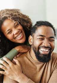 A man and woman are embracing each other in a warm hug.