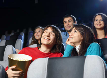 a group of people watching a movie in the cinema