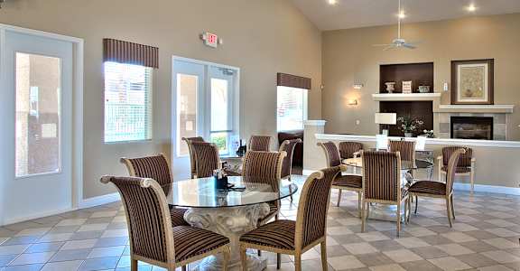 a dining room with a table and chairs and a fireplace
