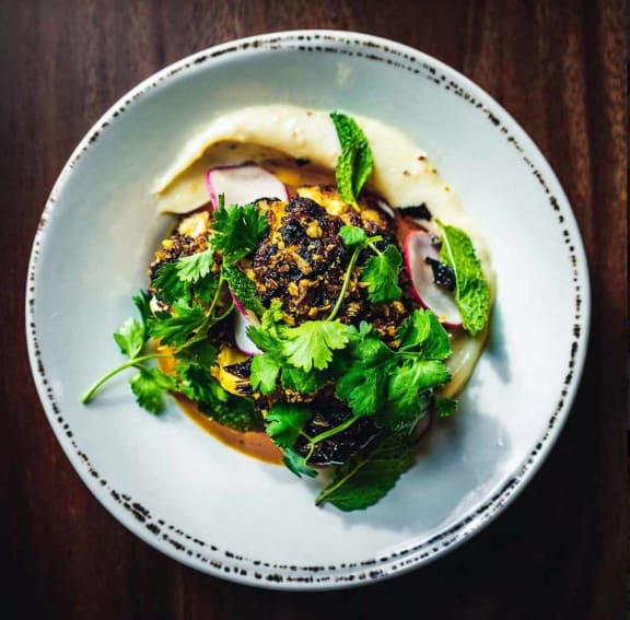 a dish of food on a plate on a table