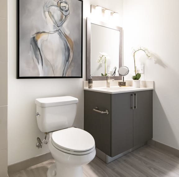 a small bathroom with a toilet sink and mirror