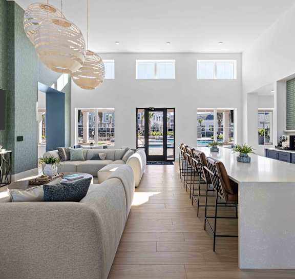 a large living room with a long table and chairs at The Quinn, Pensacola, FL, 32526