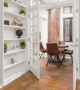 a kitchen with stainless steel appliances and white cabinets at Park Heights by the Lake Apartments, Illinois, 60649