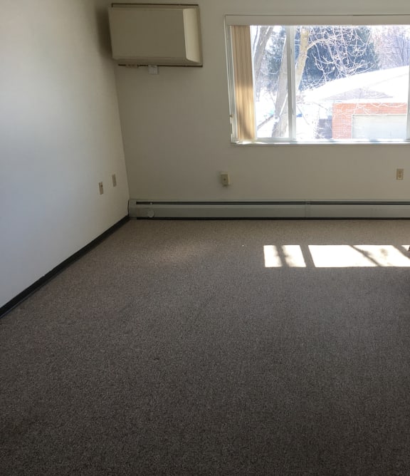 a living room with a couch and a chair and a table