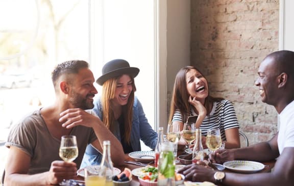 Friends laughing at Stone Canyon Apartments, California,92507