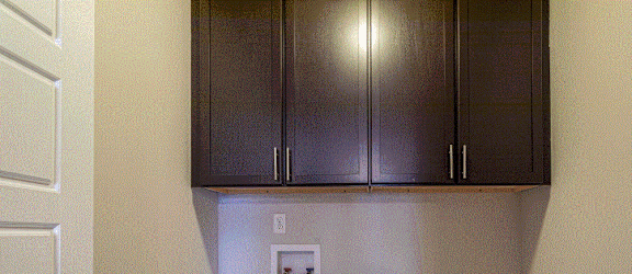 a washer and dryer room with white appliances