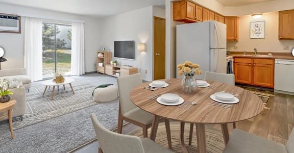 a dining room and living room with a table and chairs