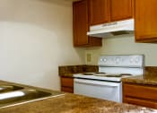 Thumbnail 10 of 12 - Apartment Kitchen at Carriage House Virginia Beach