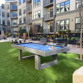 a ping pong table in a courtyard with an apartment building at The Yards at Malvern, Malvern, Pennsylvania