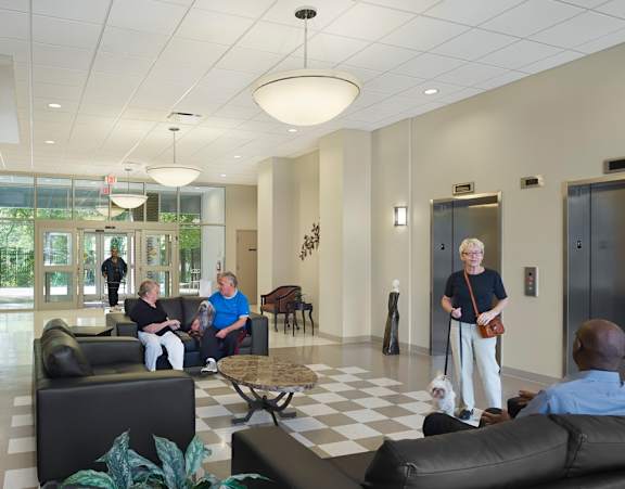a group of people in a lobby of a building