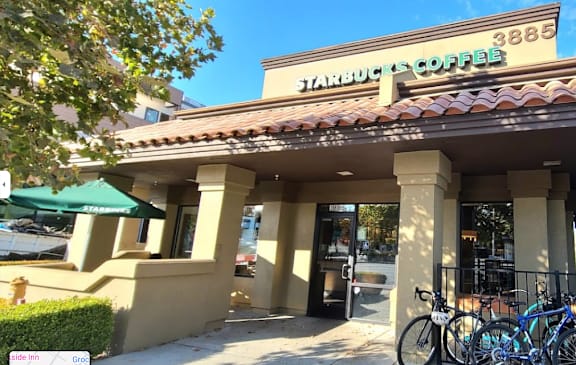 the front of a building with bikes parked outside
