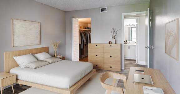Spacious bedroom with natural light at Coronado Springs Apartments in Palm Springs, FL. Comfortable one- and two-bedroom pet-friendly floor plans
