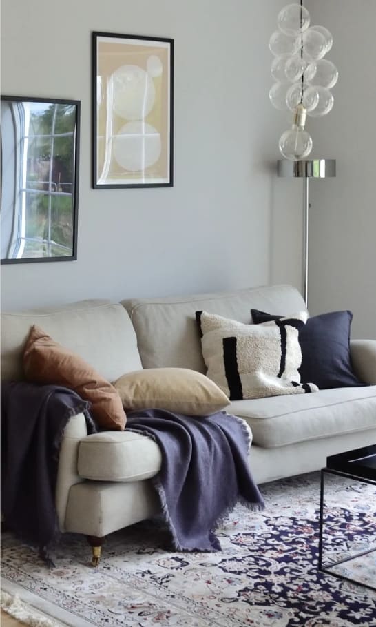 a living room with a white couch and a coffee table