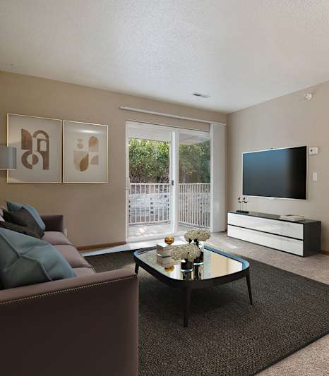 A living room with a brown couch and a black coffee table.