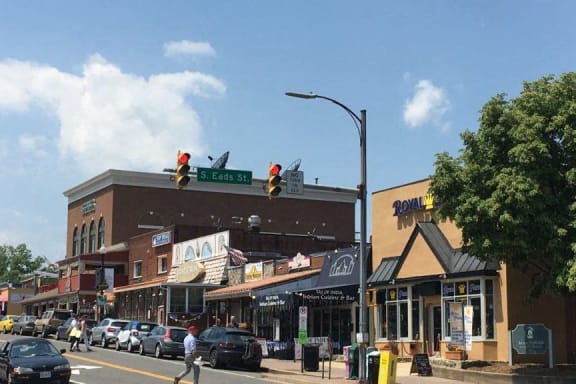 a busy city street with traffic lights and buildings